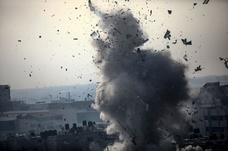 Debris and shrapnel fly following an Israeli airstrike in Rafah in southern Gaza on Friday, December 1, 2023, as fighting resumed after mediators failed in their bid to extend a 7-day temporary truce between Israel and Hamas. Photo by Ismael Mohamad/UPI