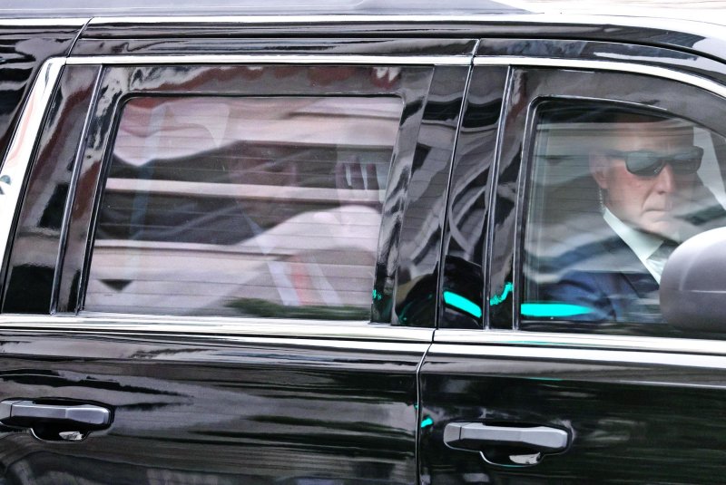 Former President Donald Trump waves from his limo as his motorcade leaves the E. Barrett Prettyman Federal Courthouse in Washington after his arraignment on election interference charges on August 3. Photo by Jemal Countess/UPI