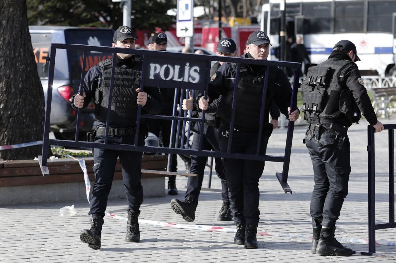 Turkish police are seen here setting barriers as forensic experts inspect the site of a blast in the Blue Mosque area in Istanbul's tourist hub of Sultanahmet, Turkey, after an attack that killed at least 10 on January 12, 2016. In Turkey's southeastern Van province on Monday, at least 48 people were injured by a car bomb explosion. FIile Photo by Ali Turkel/UPI