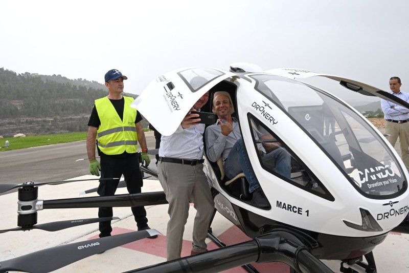 People take photos inside a drone taxi after a test flight at Hadassah Hospital Ein Kerem in Jerusalem on Wednesday. Photo by Debbie Hill/UPI