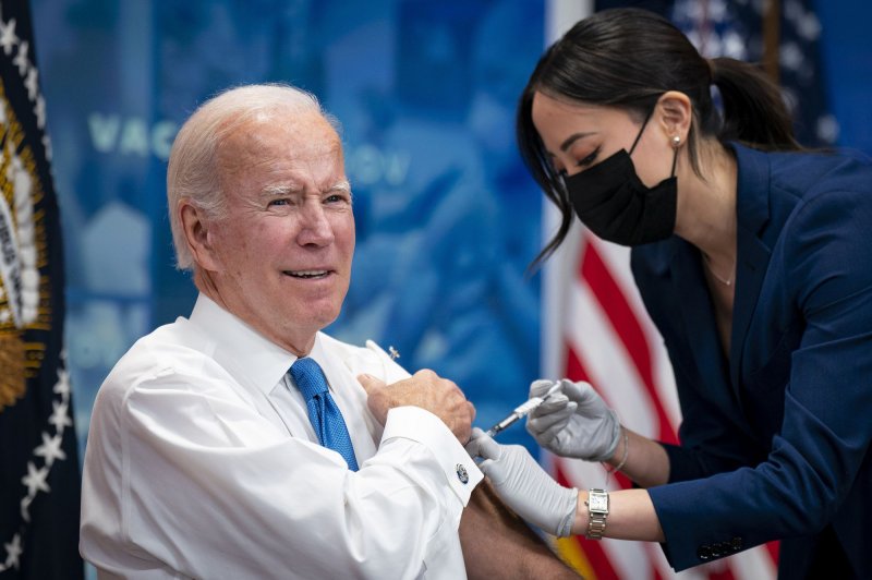 President Joe Biden prepares receives a booster dose of the COVID-19 vaccine, which targets the Omicron BA.4/BA.5 subvariants, in the Eisenhower Executive Office Building in Washington, D.C., on Tuesday. Photo by Al Drago/UPI