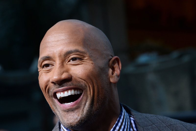 Dwayne Johnson portrays a helicopter pilot trying to save his estranged wife and daughter from an earthquake in the new trailer for the forthcoming thriller "San Andreas." File photo by Jim Ruymen/UPI