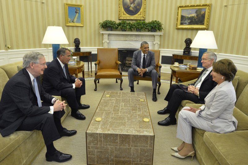 U.S. President Barack Obama (C) holds a meeting with Congressional leaders (L-R) Senate Minority Leader Mitch McConnell (R-KY), House Speaker John Boehner (R-OH), Senate Majoity Leader Harry Reid (D-NV) and Minority Leader Nancy Pelosi (D-CA) in the Oval Office at the White House, June 18, 2014, in Washington, DC. The meeting was for briefings on the deteriorating situation in Iraq, as the militants of the Islamic State of Iraq and Syria continue consuming Iraqi territory on the road to Baghdad. UPI/Mike Theiler