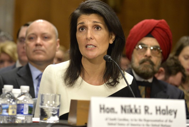South Carolina Gov. Nikki Haley, nominated to be U.S. ambassador to the United Nations, speaks as her father, Ajit Singh Randhawa (R) listens, during her confirmation hearing before the Senate Foreign Relations Committee on Wednesday. Haley, a critic of many of President Barack Obama's foreign policies, has said she will "take an outsiders look at the institution." Photo by Mike Theiler/UPI