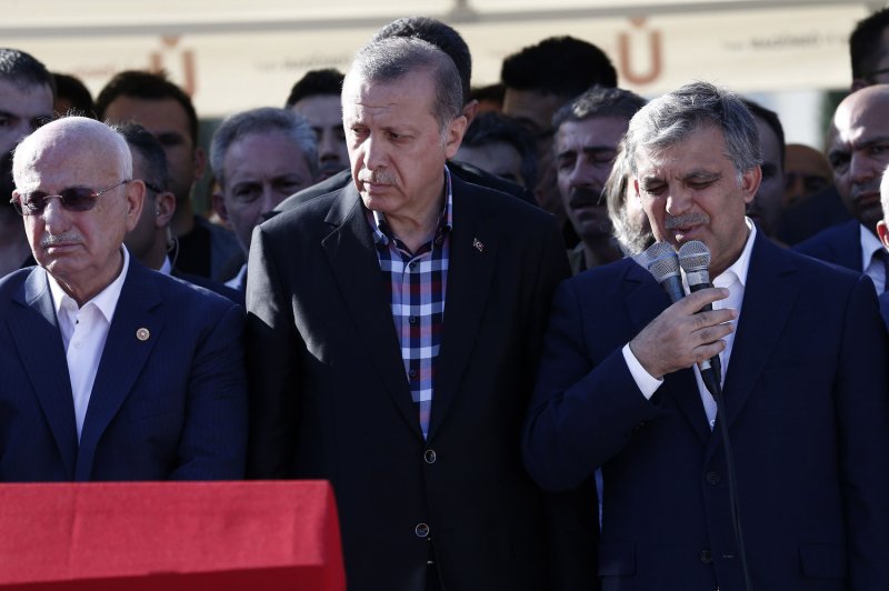 Turkish President Recep Tayyip Erdogan (C), attends the funeral of the victims of the coup attempt in Istanbul in Turkey on Sunday. Erdogan vowed to purge the "virus" within state bodies, during a speech at the funeral of victims killed during the coup bid he blames on his enemy Fethullah Gulen who lives in the United States. More than 50,000 people have been arrested, fired or suspended following the coup attempt. Photo by CemTurkel/ UPI