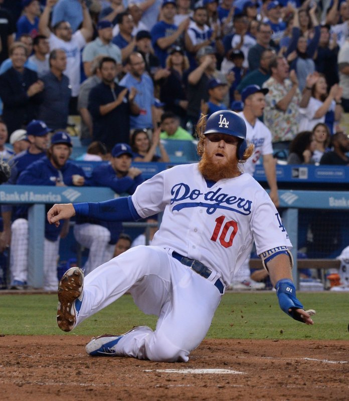 Justin Turner of the Los Angeles Dodgers slides home in a recent game. Photo by Jim Ruymen/UPI