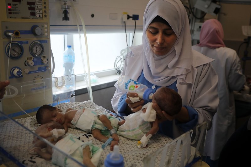 Palestinian medics care for babies evacuated from Al Shifa hospital to the Emirates hospital in Rafah in the southern Gaza Strip, on Sunday, November 19, 2023. A top health official in Gaza Strip said all 31 premature babies at Al-Shifa hospital had been evacuated on November 19 from the facility that the World Health Organization now calls a "death zone". Photo by Ismail Muhammad/UPI