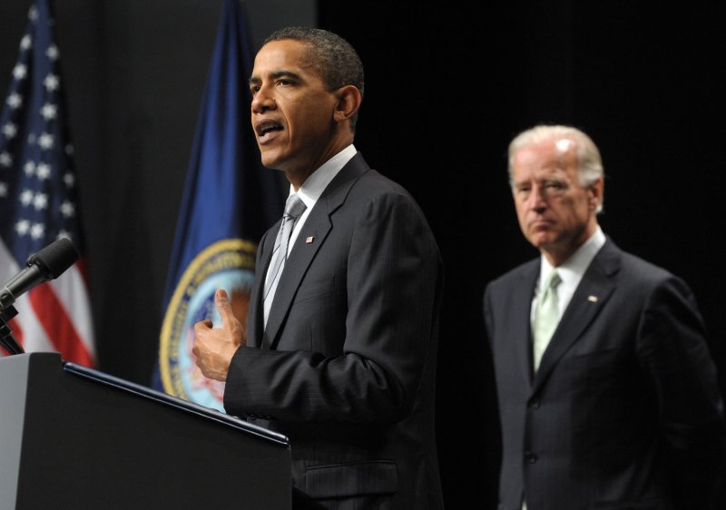 U.S. President Barack Obama speaks as Vice President Joe Biden looks on during an event to mark the implementation of the Post-9/11 GI Bill at George Mason University in Fairfax, Virginia on August 3, 2009. UPI Photo/Roger L. Wollenberg | <a href="/News_Photos/lp/047af32c4e77b5be51ca14f4f7a81b27/" target="_blank">License Photo</a>