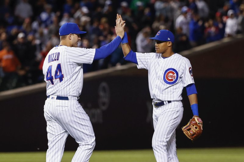 Chicago Cubs' Anthony Rizzo (L) celebrates with Addison Russell (R) after their win against the Miami Marlins at Wrigley Field. File photo by Kamil Krzaczynski/UPI