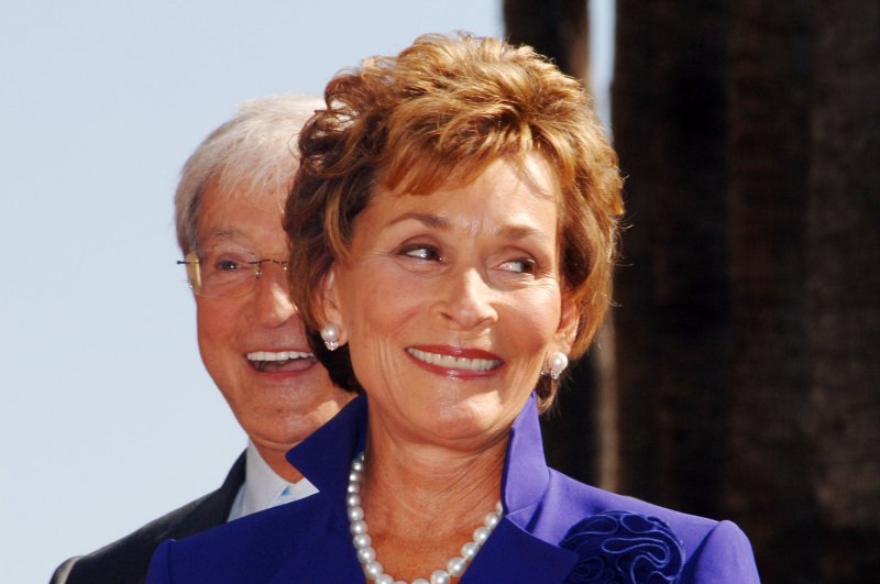 Judge Judy Sheindlin, the star of television's number one syndicated courtroom series that bears her name, reacts to fans during a ceremony honoring her with the 2,304th star on the Hollywood Walk of Fame in Los Angeles, California February 14, 2006. Looking on at left, rear is her husband Judge Jerry Sheindlin. (UPI Photo/Jim Ruymen)