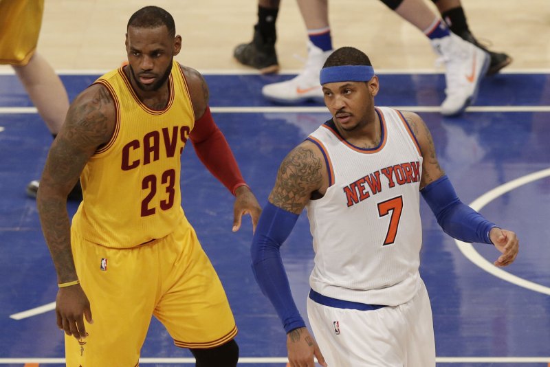 Cleveland Cavaliers' LeBron James and New York Knicks' Carmelo Anthony stand on the court in the first half at Madison Square Garden in New York City on March 26, 2016. Photo by John Angelillo/UPI