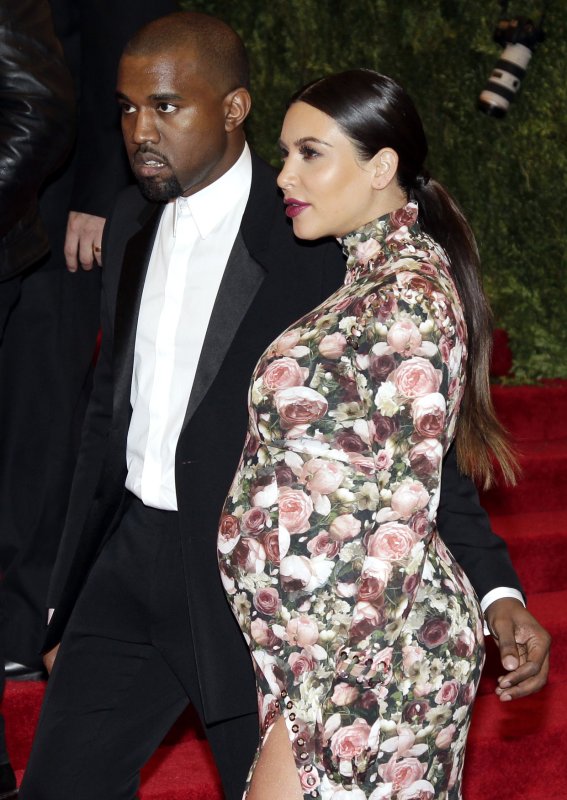 Kim Kardashian and Kanye West arrive on the red carpet at the Costume Institute Benefit at the Metropolitan Museum of Art in New York City on May 6, 2013. UPI/John Angelillo