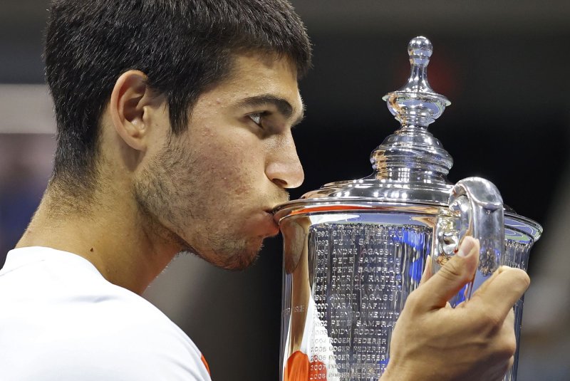 Carlos Alcaraz of Spain kisses his trophy after defeating Casper Ruud of Norway in the Men's Finals of the 2022 US Open Tennis Championships at Arthur Ashe Stadium at the USTA Billy Jean King National Tennis Center in Flusing, N.Y. Sunday. Alcaraz won the match 6-4, 2-6, 7-6, 6-3. Photo by John Angelillo/UPI | <a href="/News_Photos/lp/193fa0c80da2d336f22bac4cc474182c/" target="_blank">License Photo</a>