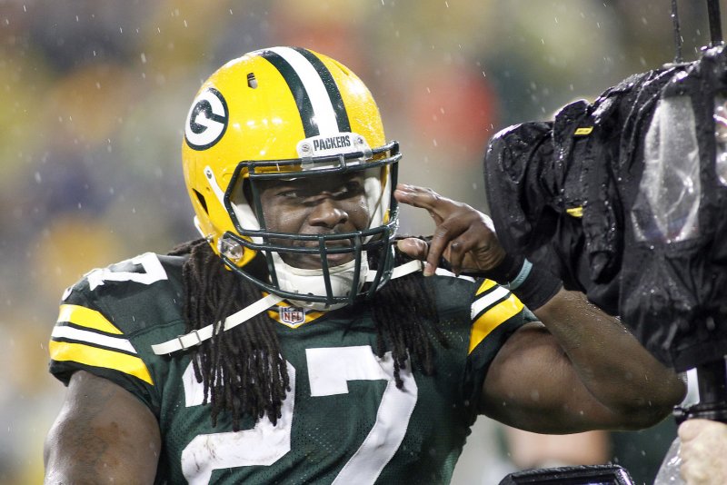 Green Bay Packers running back Eddie Lacy salutes the television camera after scoring a touchdown in the first quarter of their game against the Chicago Bears November 26, 2015, at Lambeau Field in Green Bay, Wisconsin. Photo by Frank Polich/UPI