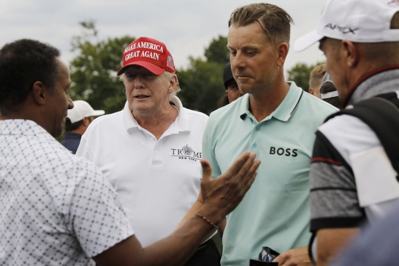 Swedish golfer Henrik Stenson meets with former President Donald Trump after winning LIV Golf Bedminster on Sunday at Trump National Golf Club in Bedminster, N.J. Photo by Peter Foley/UPI