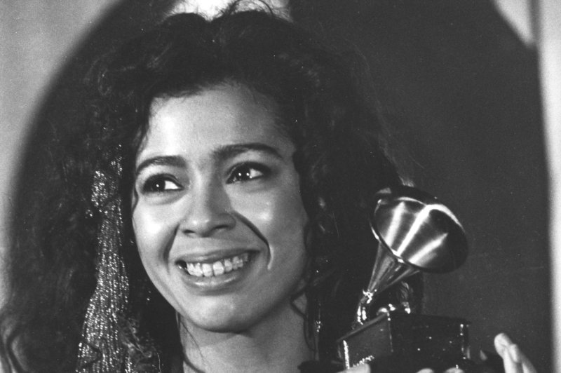 Irene Cara, who died Friday at the age of 63, is seen here clutching her Grammy Award for best Pop Vocal performance, Female at the 1984 Grammy Award ceremonies in Los Angeles. File Photo by Susan Ragan/UPI