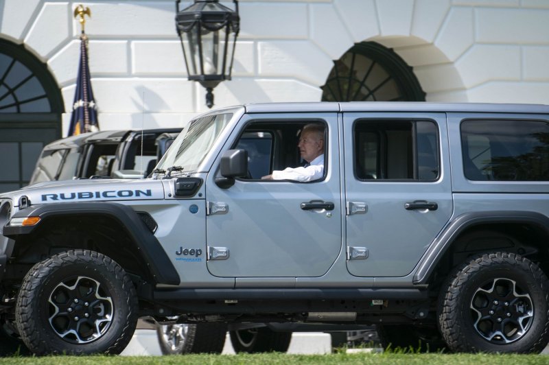 President Joe Biden checks out a Jeep Wrangler Unlimited 4xe Rubicon, a hybrid sport-utility vehicle, at the White House on August 5, 2021. Since taking office, Biden has made electric vehicle manufacturing and a national network of charging stations a top priority on his environmental agenda. File Photo by Sarah Silbiger/UPI