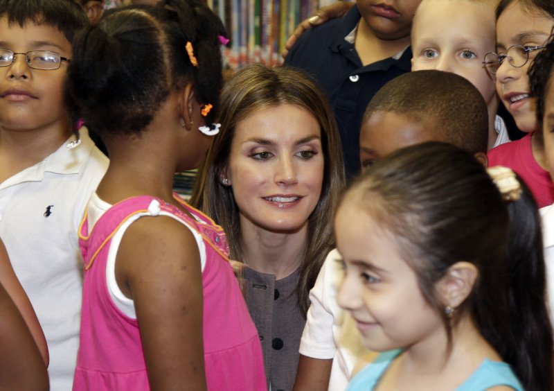 Spain's Princess Letizia Kneels down among children in a classroom as she tours P.S. 75 Emily Dickinson School with city officials, diplomats and school administrators in New York City on June 22. U.S. schools are falling behind China's and India's in preparing children for college. UPI/John Angelillo | <a href="/News_Photos/lp/dd755d0f65b125c87b69fc1d55809358/" target="_blank">License Photo</a>