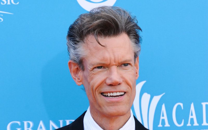Country music star Randy Travis was arrested for public intoxication outside a Dallas church Monday morning, police said.