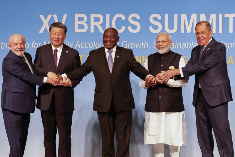 Left to right, President of Brazil Luiz Inacio Lula da Silva, President of China Xi Jinping, South African President Cyril Ramaphosa, Prime Minister of India Narendra Modi and Russia's Foreign Minister Sergei Lavrov pose for a BRICS family photo during the 2023 BRICS Summit at the Sandton Convention Center in Johannesburg on Wednesday. Photo by Gianluigi Guercia/UPI