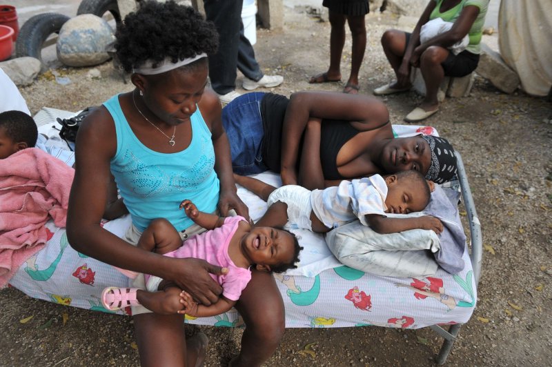 A women cares for a child at an orphanage in Port-au-Prince, Haiti on January 26, 2010. Haiti continues to suffer after a 7.0 magnitude earthquake devastated the country on January 12. UPI/Kevin Dietsch