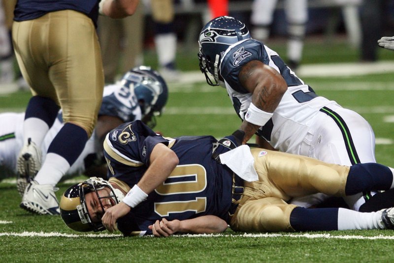 St. Louis Rams quarterback Marc Bulger lays on the turf with a concussion after being sacked against the visiting Seattle Seahawks on November 25, 2007. File photo by Bill Greenblatt/UPI | <a href="/News_Photos/lp/639ddc3de9889dd9a4beb60b12a769b3/" target="_blank">License Photo</a>