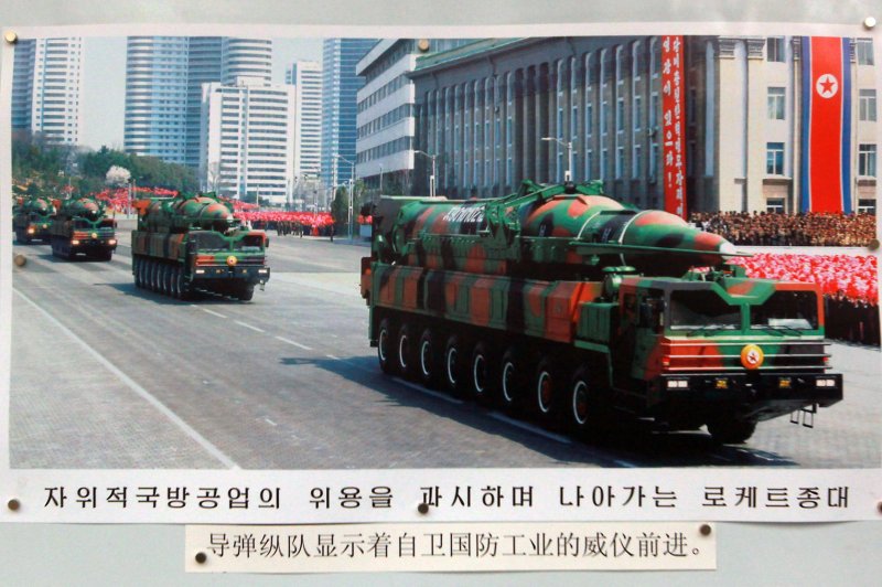 A photo of a mobile, long-range missile launcher, which has alarmed the Pentagon, is displayed on a picture board in front of the North Korean Embassy in Beijing. Engineers of Pyongyang’s second economic commission began working on rail-based launchers in 2016. UPI/Stephen Shaver