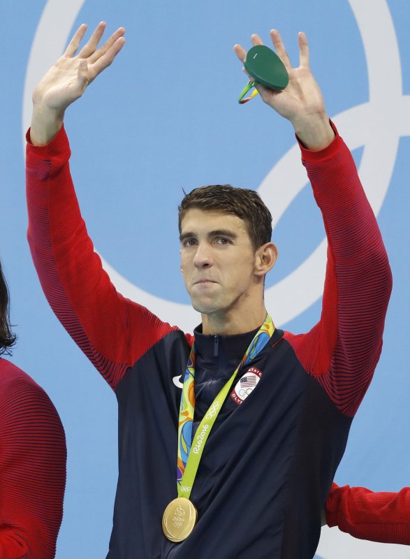 Michael Phelps celebrates winning gold after the men's 4 x 100m medley relay final at the Olympic Aquatics Stadium at the 2016 Rio Summer Olympics in Brazil on August 13, 2016. The medal was Phelps' 23rd gold, making him the most decorated Olympian in history. File Photo by Matthew Healey/UPI | <a href="/News_Photos/lp/86dea94c48231f850ad55e5641a44562/" target="_blank">License Photo</a>