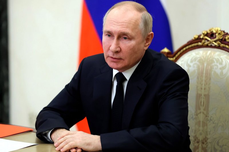Russian President Vladimir Putin will not hold an annual news conference as scheduled this month, instead moving it to an unspecified date next year, Russian media reported on Monday. Pool Photo courtesy of the Kremlin