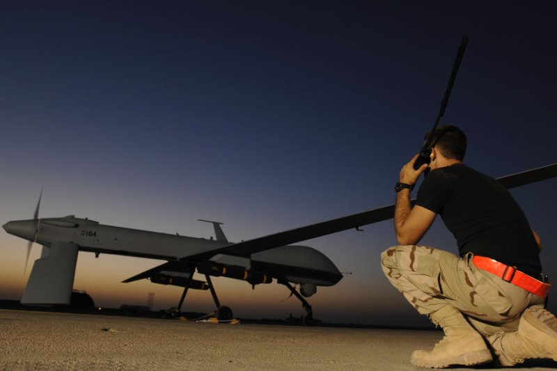 U.S. Air Force Airman 1st Class Justin Cole communicates with the pilot of an MQ-1 Predator unmanned aerial vehicle prior to a night mission from Ali Air Base, Iraq on November 5, 2007. UPI/Jonathan Snyder/U.S. Air Force