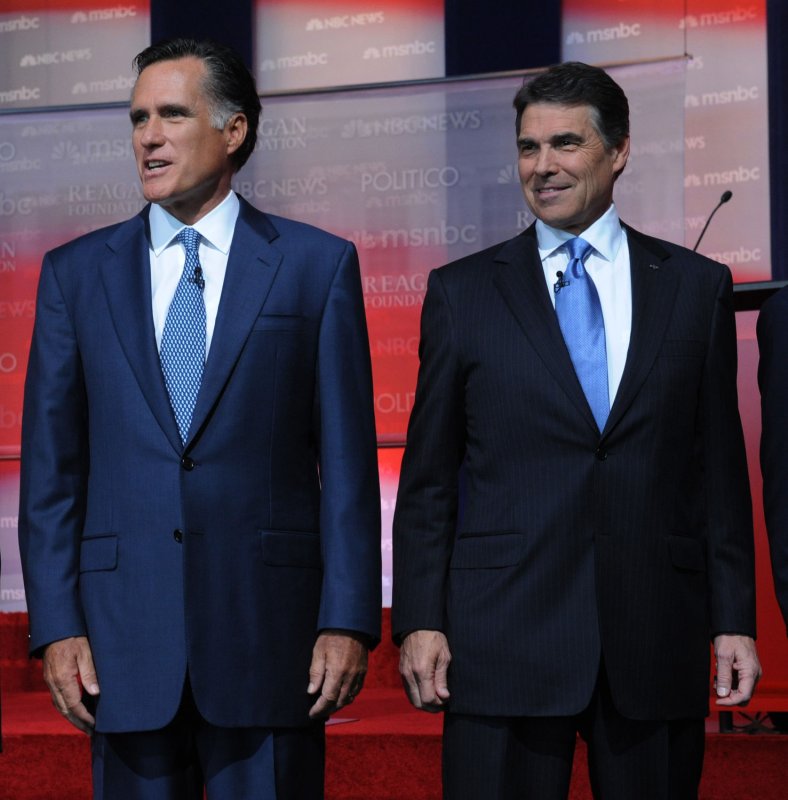 Presidential candidates Mitt Romney (L) and Rick Perry arrive on stage before the start of the Republican presidential primary debate at the Ronald Reagan Presidential Library in Simi Valley, California on September 7, 2011. UPI/Jim Ruymen | <a href="/News_Photos/lp/c89815fe9b0f0cd890e125520028bfa6/" target="_blank">License Photo</a>