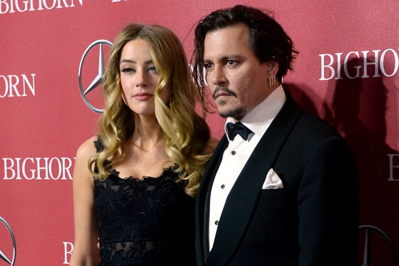 Actors Amber Heard and Johnny Depp attend the Palm Springs International Film Festival awards gala on Jan. 2. Depp has mocked a video he recorded with Heard apologizing for ilegally smuggling their two Yorkshire terriers into Australia. File Photo by Jim Ruymen/UPI | <a href="/News_Photos/lp/ace5ade4f607c01dfe78950272cd1823/" target="_blank">License Photo</a>