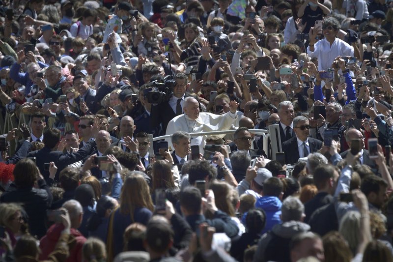 Pope Francis waves to the faithful at the end of the Easter Mass in St. Peter's Square at the Vatican on Sunday. Photo by Stefano Spaziani/UPI | <a href="/News_Photos/lp/741e050e166a25359c56c554786707f9/" target="_blank">License Photo</a>