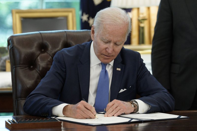 President Joe Biden signs the Ukraine Lend-Lease Act in the Oval Office of the White House on Monday. The White House on Wednesday announced a plan to improve permitting for infrastructure projects. Photo by Yuri Gripas/UPI | <a href="/News_Photos/lp/f633167b6f3d1b54e231e9d054a8f104/" target="_blank">License Photo</a>