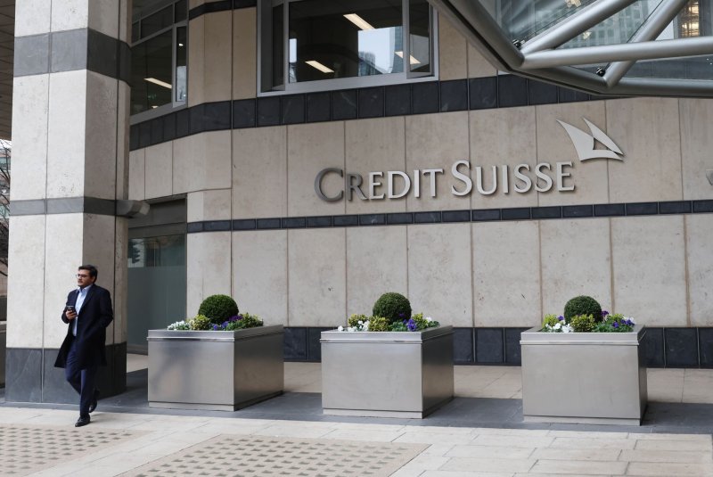 A man walks past Swiss bank Credit Suisse in London's Canary Wharf on Monday. Banking shares tumbled at the open of European markets Monday as they digested news of an emergency rescue takeover of the troubled European banking giant Credit Suisse by Union Bank of Switzerland for just $3.2 billion. Photo by Hugo Philpott/UPI
