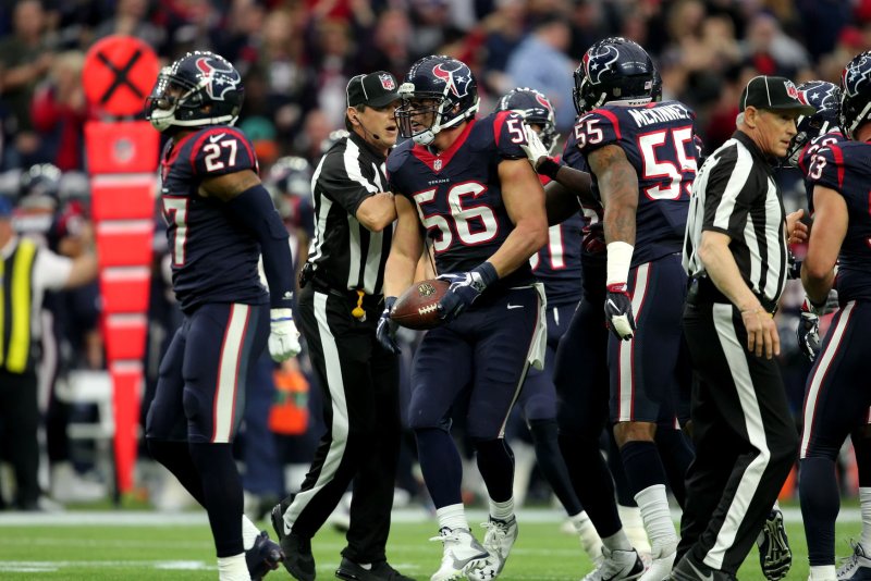 Houston Texans inside linebacker Brian Cushing (56) is congratulated by teammates after an interception in the first quarter of their NFL Wild Card Round game at NRG Stadium on January 9, 2016 in Houston. Photo by Erik Williams/UPI