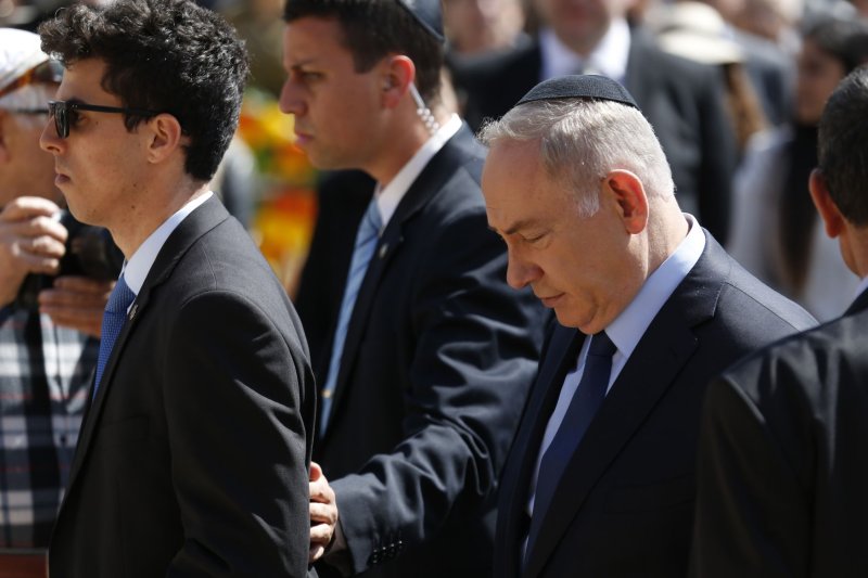 Israeli Prime Minister Benjamin Netanyahu, right, attends a ceremony marking the annual Holocaust Remembrance Day at the Yad Vashem Holocaust memorial, in Jerusalem on Monday. Pool Photo by Amir Cohen/UPI