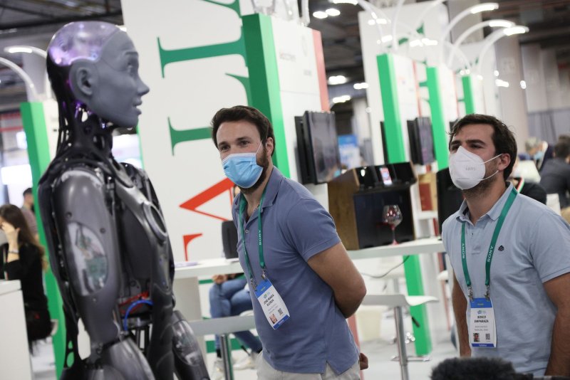 Attendees take a closer view of Ameca,&nbsp; touted as the world's most advanced human-shaped robot, during the 2022 International CES at the Sands Convention Center in Las Vegas on Wednesday. Photo by James Atoa/UPI