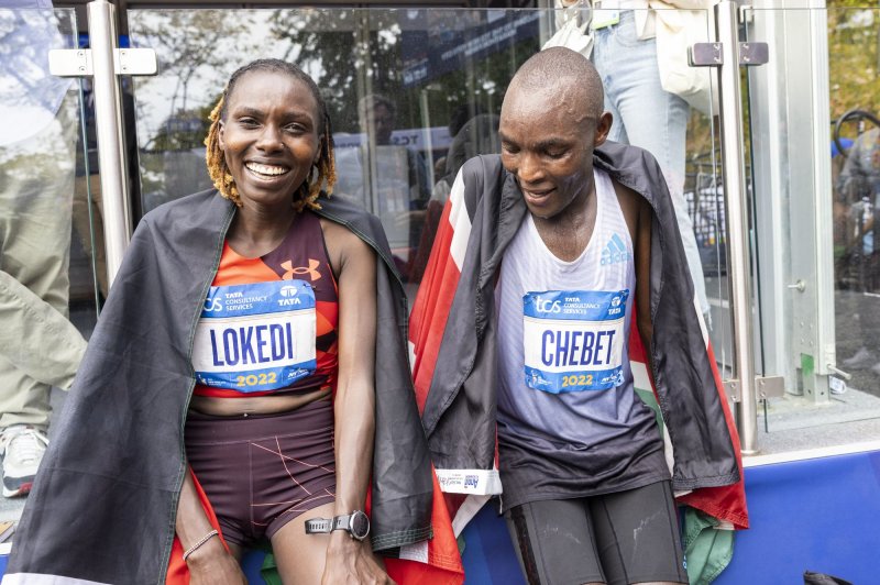 Sharon Lokedi of Kenya, left, winner of the Women's Division, sits with the winner of the Men's Division Evans Chebet of Kenya of the New York City Marathon on Sunday. Photo by Corey Sipkin/UPI