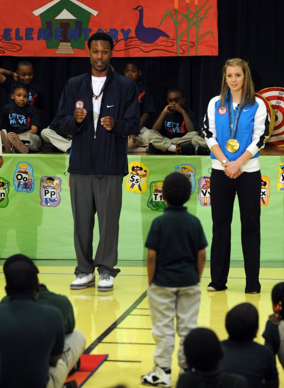 2010 Gold Medal Olympians Hannah Kearney and Shani Davis talk to students about the importance of exercise as part of the "Let's Move!" initiative at River Terrace Elementary School in Washington on April 20, 2010. UPI/Roger L. Wollenberg | <a href="/News_Photos/lp/b98ebefadfd5baa4c7783f044f73dfba/" target="_blank">License Photo</a>
