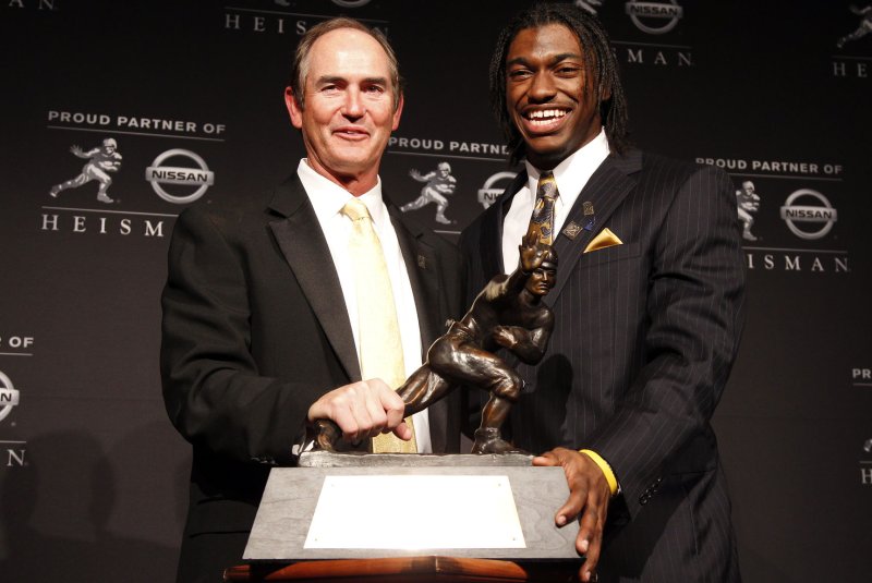 Former Baylor Bears head coach Art Briles and quarterback Robert Griffin III stand with the Heisman Trophy after Griffin wins the the 2011 Heisman Trophy Award at the Marriott Marquis in New York City. File photo by John Angelillo/UPI