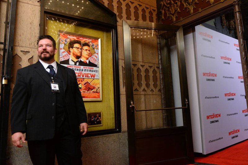 Heavy security is seen outside The Theatre at Ace Hotel before the premiere of the motion picture comedy "The Interview" in Los Angeles on Dec. 11, 2014. A year after North Korea launched a cyberattack against Sony Pictures, a South Korean analyst stated Pyongyang is preparing a large-scale cyber war to paralyze millions of South Korean computers. File Photo by Jim Ruymen/UPI