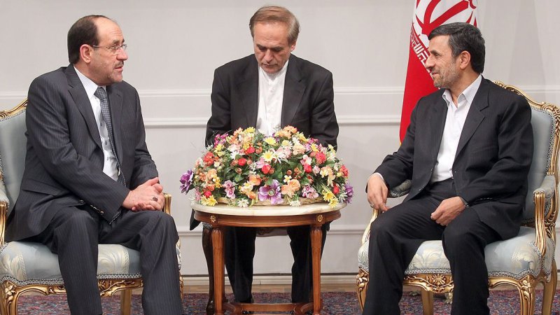 A handout picture, made available by Iranian President Mahmoud Ahmadinejad's official website on April 23,2012, shows Iranian President Mahmoud Ahmadinejad (R) speaking with Iraqi Prime Minister Nuri Al-Maliki (L) during their official meeting in presidential palace in Tehran, Iran, on April 22,2012. UPI
