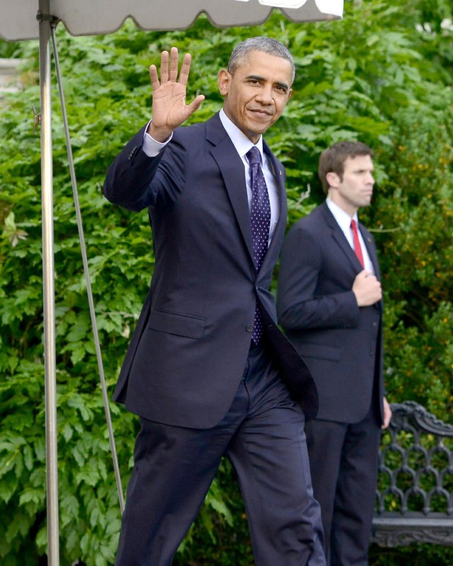 United States President Barack Obama waves to the press as he departs the South Lawn of the White House in Washington, DC en route Warsaw, Poland on June 2, 2014. His trip will take him to Poland, the G-7 meeting in Brussels, Belgium, and to Normandy, France for the commemoration of the 70th Anniversary of the D-Day invasion before he returns home on Friday. UPI/Ron Sachs/POOL