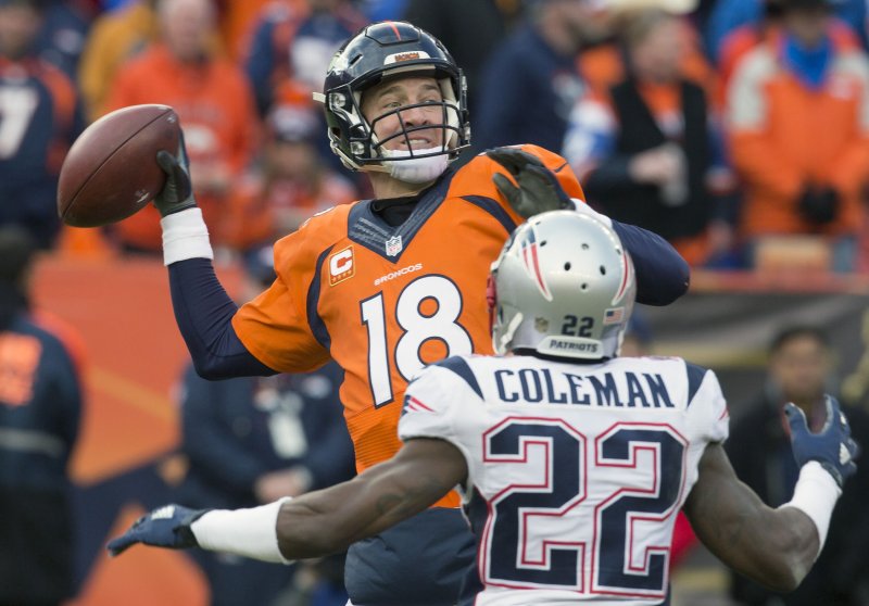 Denver Broncos quarterback Peyton Manning throws under pressure in the third quarter against New England Patriots cornerback Justin Coleman (22) during the 2016 AFC Championship game. A free agent, Coleman signed exclusive rights with the Patriots on Friday. Gary C. Caskey/UPI