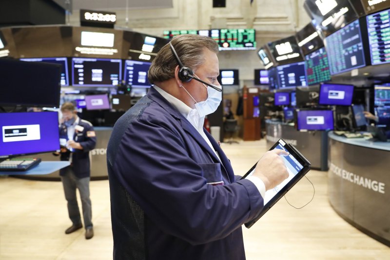 Traders work on the floor of the NYSE at the opening bell at the New York Stock Exchange on Wednesday. The Labor Department said the producer's price index increased 0.2% in December. Photo by John Angelillo/UPI