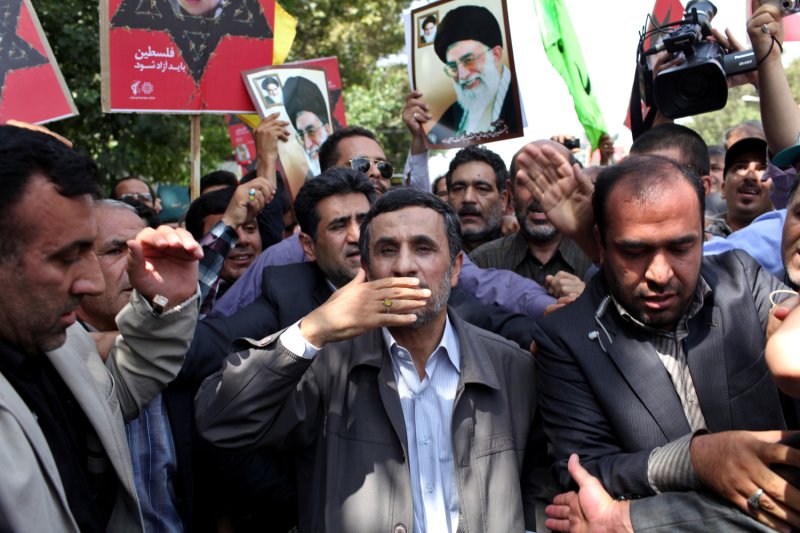 Iran's President Mahmoud Ahmadinejad blows kisses to supporters as he attends a Jerusalem Day (al-Quds Day) rally on August 2, 2013 in Tehran, Iran. Most Islamic states mark the annual event, which happens on the last Friday of the holy month of Ramadan. UPI/Maryam Rahmanian