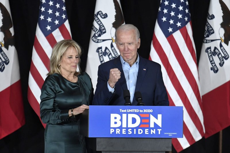 Democratic presidential candidate Joe Biden makes a fist as he arrives Monday night with his wife Dr. Jill Biden to address supporters at a caucus night event, at Drake University in Des Moines, Iowa. Photo by Mike Theiler/UPI