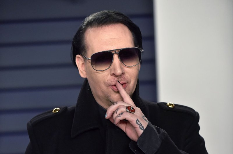 Marilyn Manson, whose real name is Brian Warner, filed a lawsuit against ex-fiancée, Evan Rachel Wood, Wednesday in Los Angeles, accusing her and Illma Gore of defamation and conspiracy.&nbsp;File Photo by Christine Chew/UPI