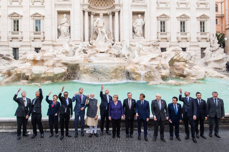 Leaders of the world's 20 leading economies pose for a group photo in front of the Trevi Fountain during the Group of 20 Summit in Rome on Saturday. On Friday, they issued a joint statement expressing deep concern about the world's response to COVID-19. Photo courtesy of G20/UPI